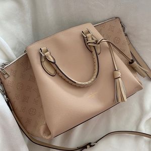 Beautiful cream leather satchel bag. Like new condition.